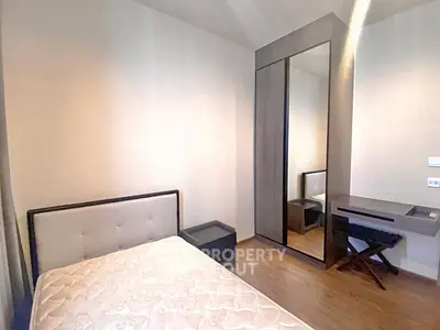 Modern bedroom with mirrored wardrobe and minimalist design