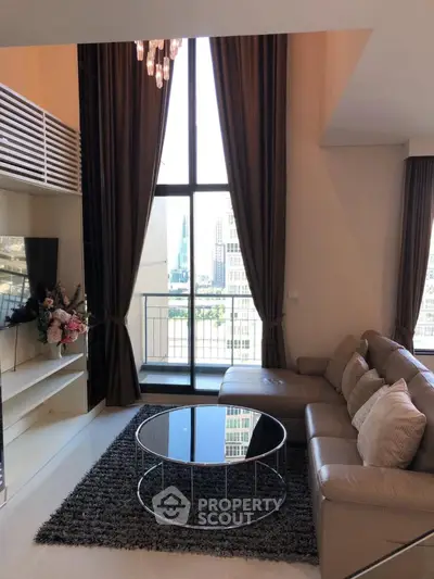 Luxurious living room with high ceiling and city view from balcony