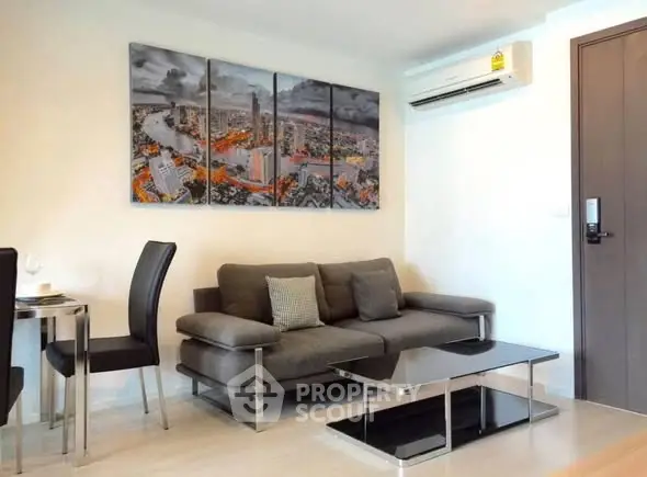 Modern living room with stylish sofa, chic artwork, and sleek dining area in a contemporary apartment.