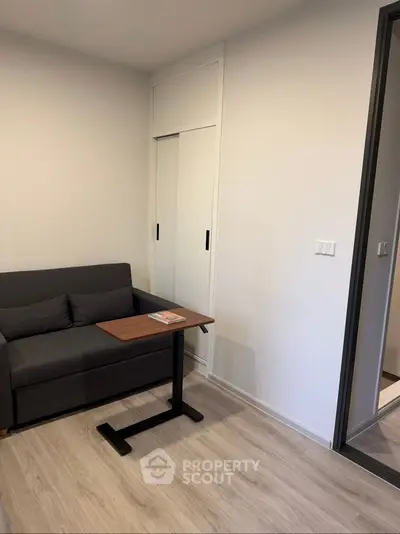 Cozy living room with modern sofa and sliding closet doors