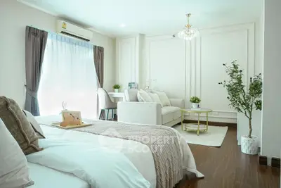 Elegant studio apartment with cozy living area and modern decor