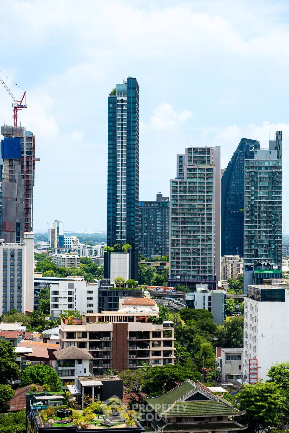 Stunning urban skyline with modern high-rise buildings and lush greenery.