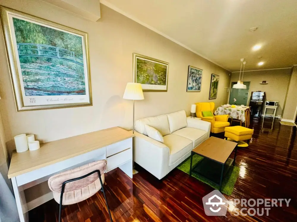 Spacious living room with modern decor, wooden flooring, and cozy seating area.