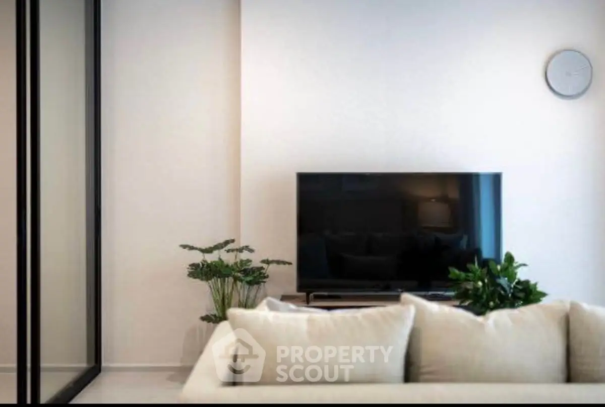 Modern living room with sleek TV and elegant decor