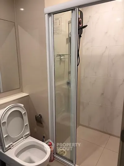 Modern bathroom with shower and toilet in sleek design