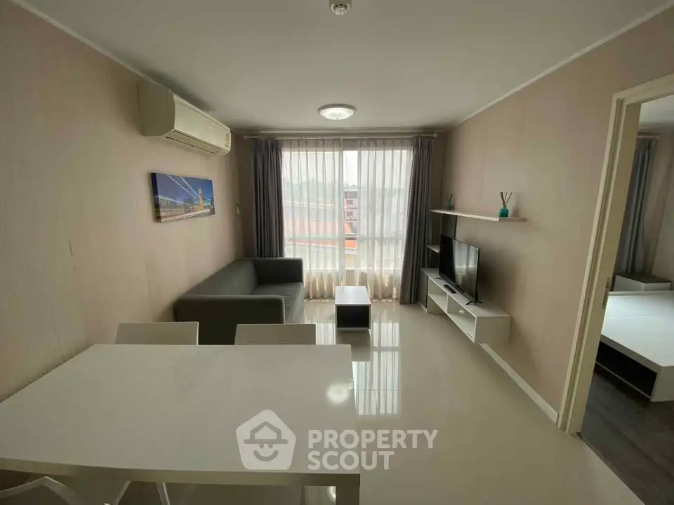 Modern living room with sleek furniture and natural light, perfect for urban living.