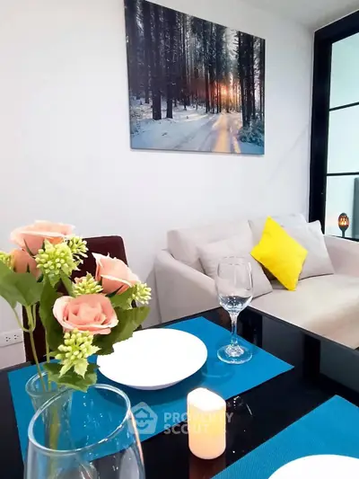 Chic modern living room with elegant dining setup and cozy sofa, perfect for stylish urban living.