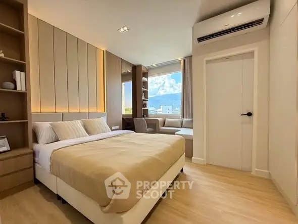 Modern bedroom with cozy bed, stylish decor, and scenic window view in a luxurious apartment.