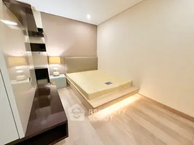 Modern minimalist bedroom with sleek design and ambient lighting