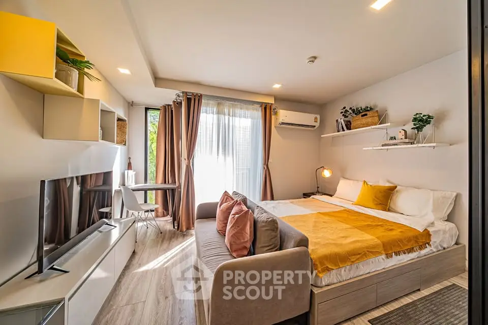 Modern studio apartment with cozy living area and stylish decor