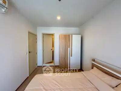 Modern bedroom with minimalist design and wooden wardrobe