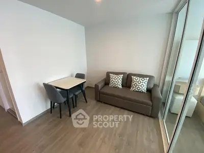 Modern living room with sleek furniture and wooden flooring