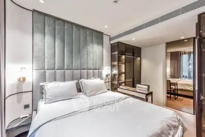 Luxurious modern bedroom with elegant decor and ample natural light