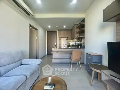 Modern living room with open kitchen and stylish furniture