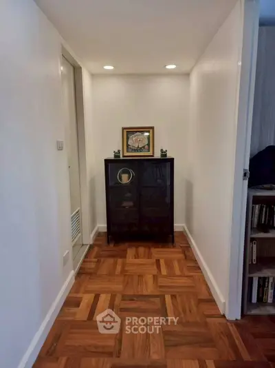 Charming hallway with elegant parquet flooring and stylish decor