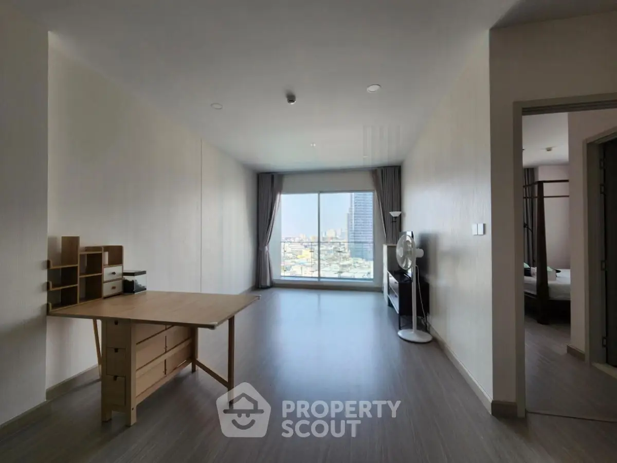 Spacious modern living room with city view and minimalist furniture