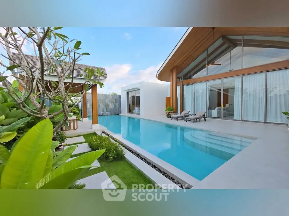 Luxurious modern villa with private pool and lush garden, perfect for serene living.