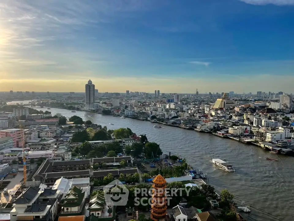 Stunning panoramic cityscape view with river and skyline at sunset, perfect for urban living enthusiasts.