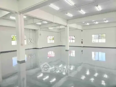 Spacious industrial warehouse with polished floors and ample natural light