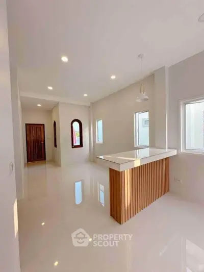 Modern open-plan living area with sleek finishes and ample natural light.