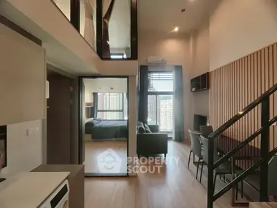 Modern duplex apartment with open living area and stylish interior design