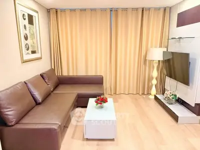 Modern living room with sleek brown leather sofa and stylish decor