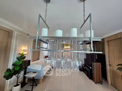 Elegant living room with modern chandelier and stylish decor