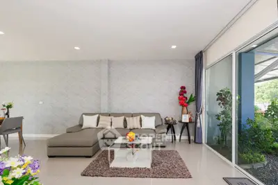 Spacious modern living room with large windows and stylish decor