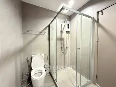 Modern bathroom with glass shower enclosure and sleek design