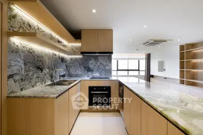 Modern kitchen with marble countertops and open layout design