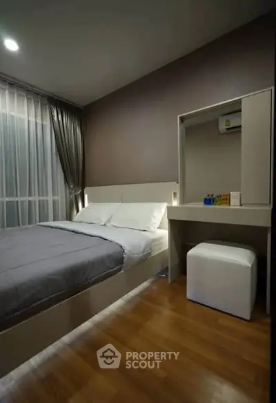 Modern bedroom with sleek design and cozy ambiance, featuring a comfortable bed and stylish furniture.