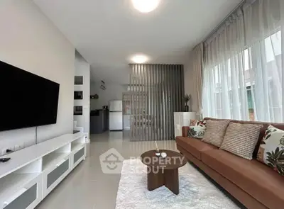 Modern living room with stylish decor and open layout, featuring a cozy sofa and sleek TV unit.