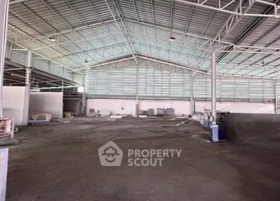 Spacious industrial warehouse with high ceilings and ample storage space