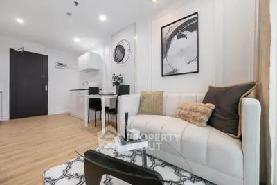 Modern living room with stylish decor and open kitchen layout