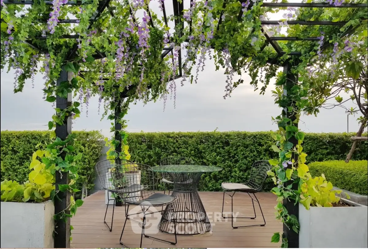 Charming garden terrace with lush greenery and elegant outdoor seating