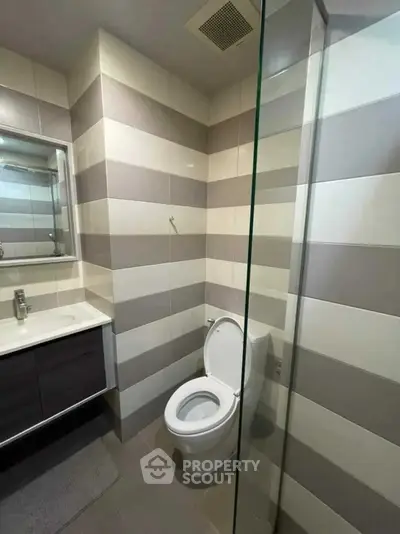 Modern bathroom with sleek design and glass shower enclosure