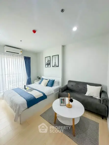 Modern studio apartment with cozy living area and stylish decor