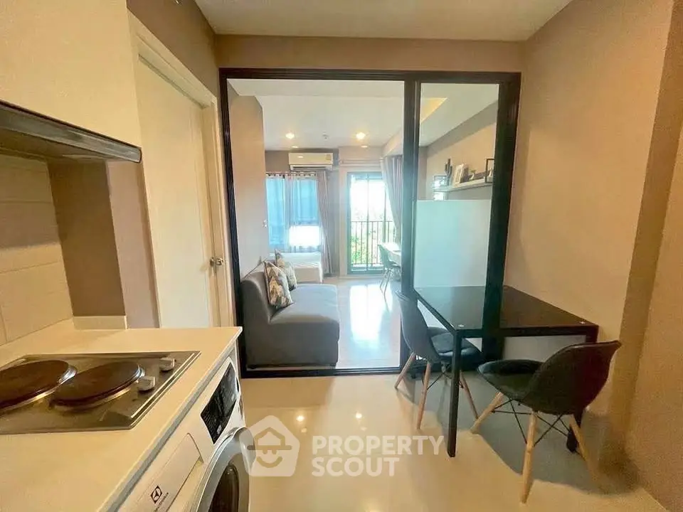 Modern apartment with open layout, cozy living area, and stylish kitchen.