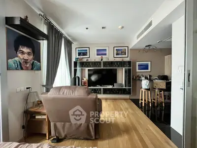 Spacious living room with modern decor and entertainment center