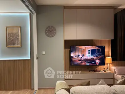 Modern living room with stylish decor and wall-mounted TV