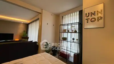 Modern living room with stylish shelving and cozy lighting, perfect for relaxation and entertainment.