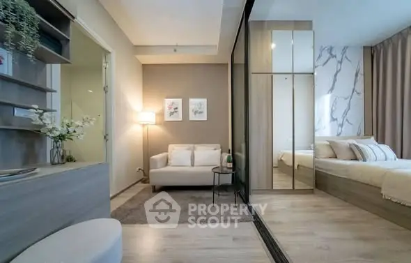 Modern studio apartment with cozy living area and stylish bedroom