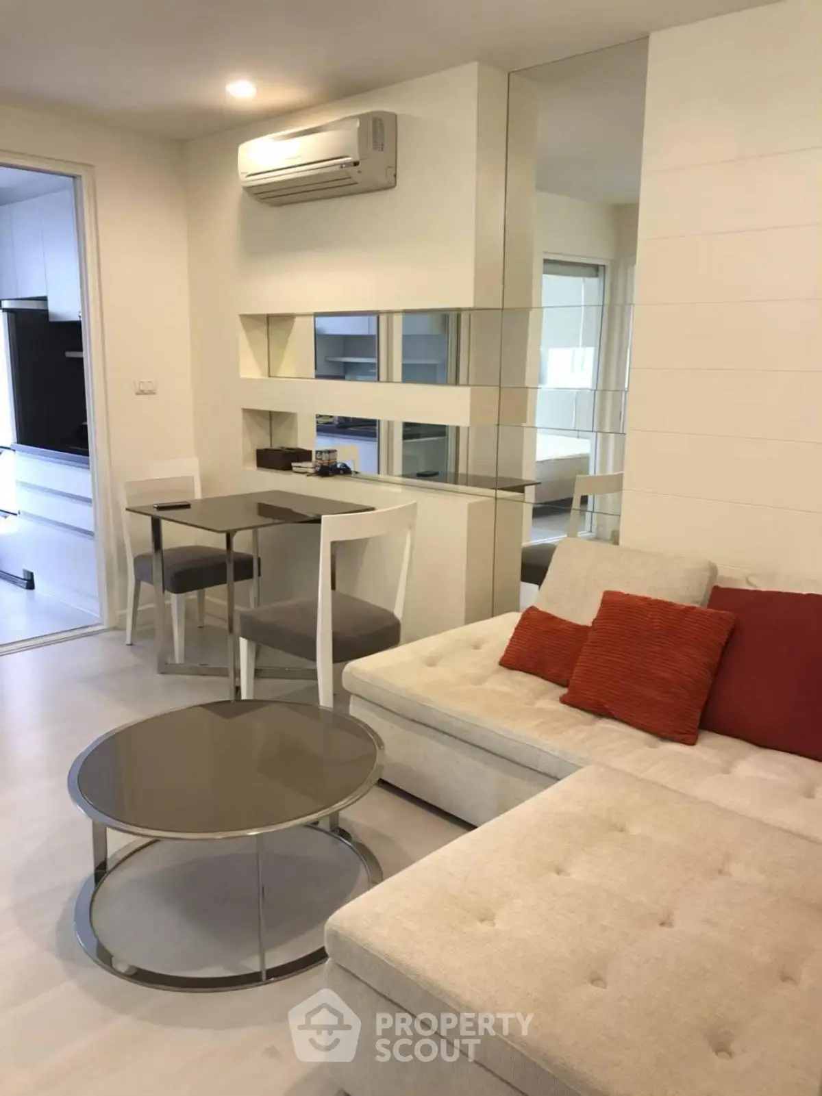 Modern living room with stylish furniture and air conditioning in a cozy apartment.