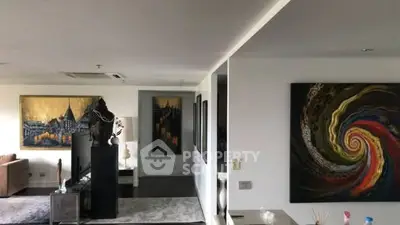 Spacious living room with modern art and elegant decor