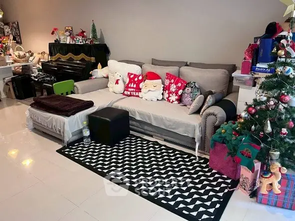 Cozy living room with festive decor and comfortable seating