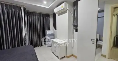 Modern bedroom with sleek design and air conditioning unit