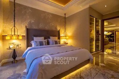 Luxurious bedroom with elegant lighting and plush bedding in a modern apartment.