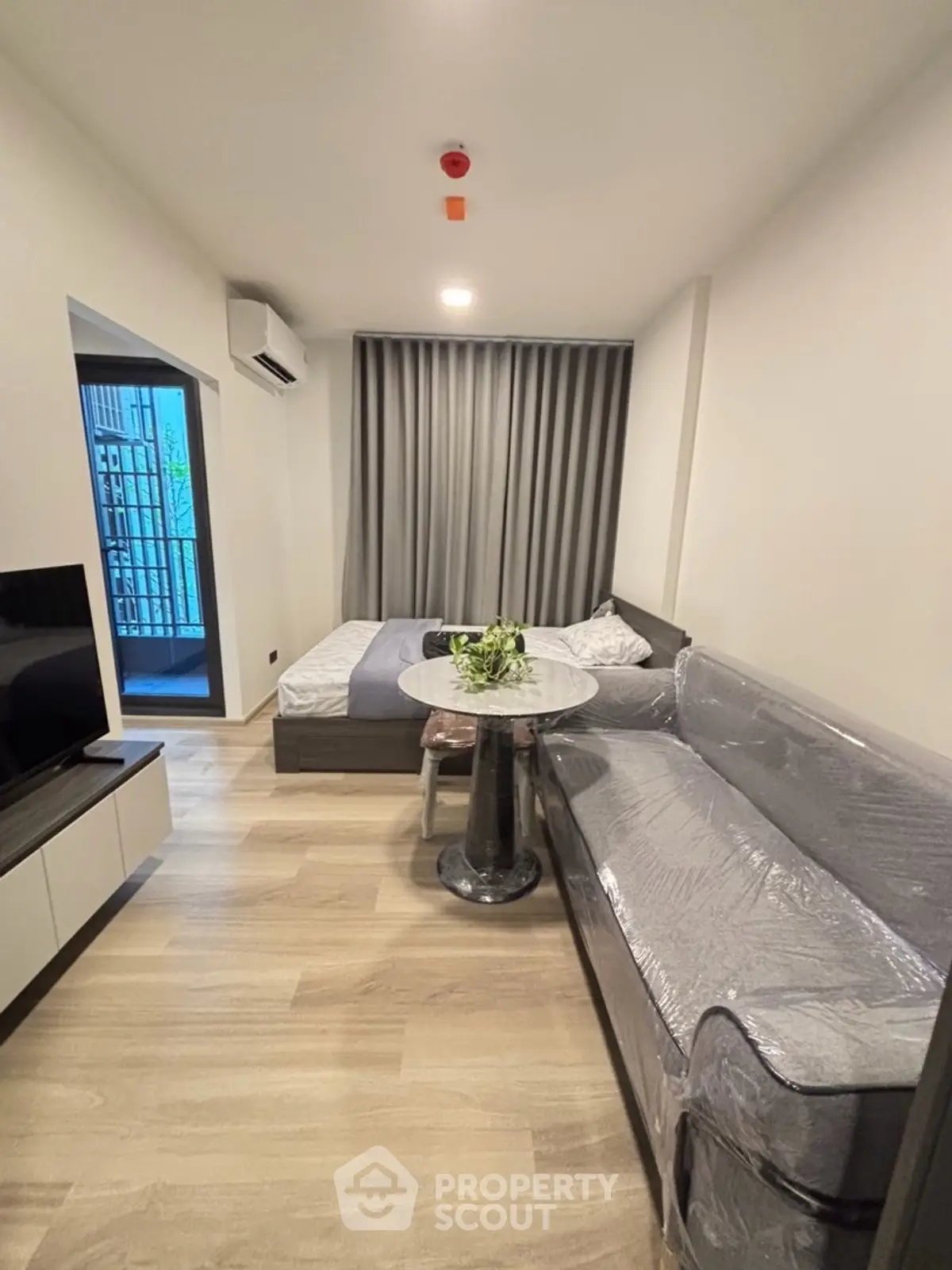 Modern studio apartment with cozy living area and stylish decor