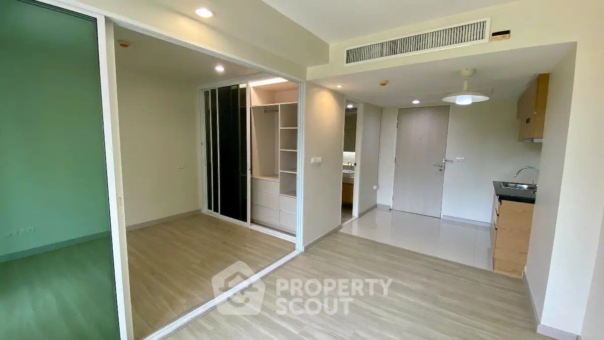 Modern apartment interior with open layout and built-in closet