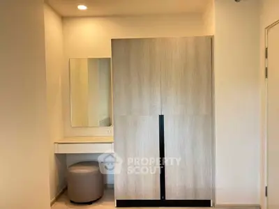 Modern bedroom with sleek wardrobe and vanity in minimalist design